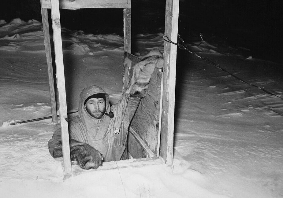 Commander_Dr._Franklin_Alton_Wade_leaving_the_Antarctic_Snow_Cruiser_through_a_hatch